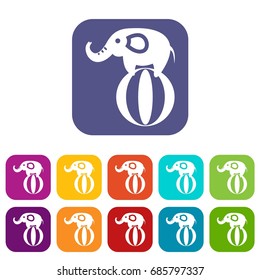 Elephant balancing on a ball icons set vector illustration in flat style in colors red, blue, green, and other