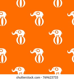 Elephant balancing on a ball pattern repeat seamless in orange color for any design. Vector geometric illustration