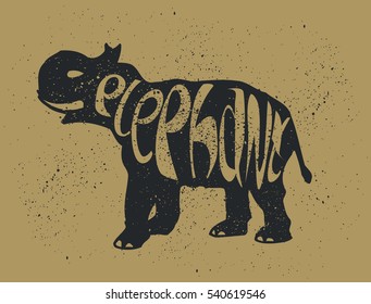 Elephant. Grunge Style with Ink splashes texture. Black Silhouette with lettering. Hand Drawn illustration on Animals theme.