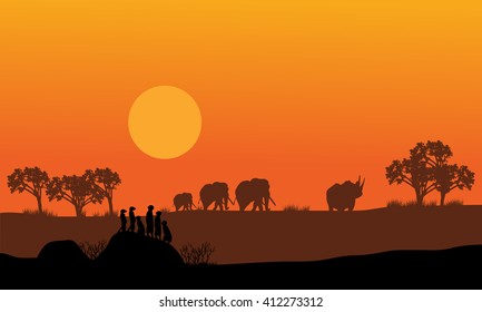 Elephant and rhino silhouette in hills scenery