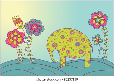 Elephant stands on a meadow surrounded by flowers