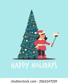 elf in uniform taking selfie photo on smartphone camera girl santa helper celebrating happy new year christmas holidays