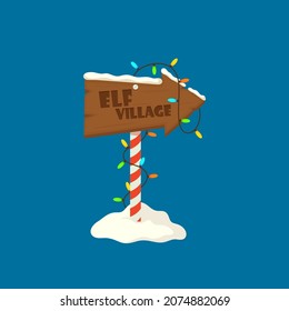 Elf Village Christmas Signboard, Wooden Sign with Snow and Garlands. Wood Banner, Road Direction Arrow on Striped Pole, Holiday Billboard Isolated on Blue Background. Cartoon Vector Illustration