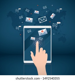 E-mail marketing concept. Computer tablet with hand opening message.