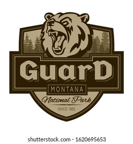 The emblem with bear. Guard National Park Montana. Guards emblem with head of bear.