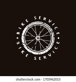 Emblem for bicycle club. Graphic design for t-shirt. White print on black background