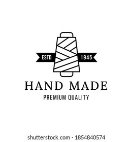 Emblem of hand made concept with thread spool icon Premium Vector. Yarn spool  logo.