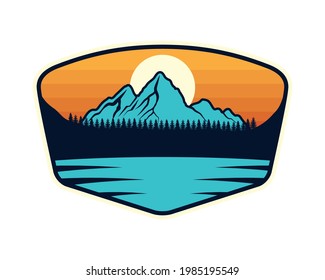 emblema con montañas y lago