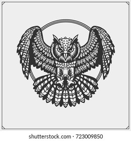 The emblem with owl with open wings.