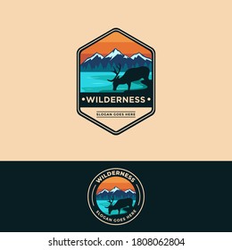 Emblem patch of wilderness, deer and mountain landscape logo vector illustration