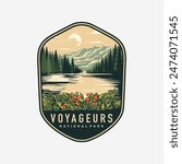 Emblem sticker patch logo illustration of Voyageurs National Park on dark background, lake and canoe vector badge