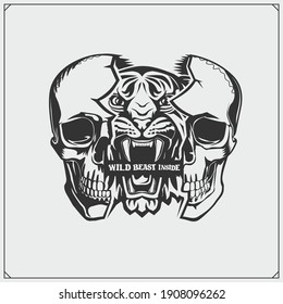 The emblem with tiger and skull for a sport team. Wild beast inside. Print design for t-shirt. 