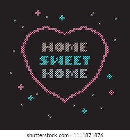 Embroidered cross-stitch house sweet house. Black background and colored floss for embroidery. 1