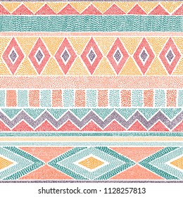 Embroidered ethnic seamless pattern. Aztec and tribal motifs. Striped ornament hand drawn. Print in the bohemian style. Vector illustration.