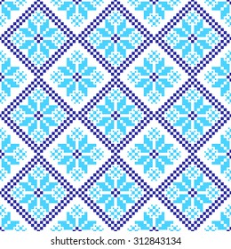 embroidered handmade cross-stitch ethnic Ukraine pattern. winter color