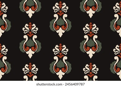 Embroidered Ikat flower pattern on a black background. Traditional ethnic ikat, Aztec abstract vector pattern, seamless pattern in tribal, folk embroidery and Mexican style.