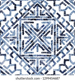 Embroidered seamless geometric pattern. Ornament for the carpet. Ethnic and tribal motifs. Colorful print of handmade. Vector illustration.