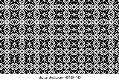 Embroidered white pattern on a black background