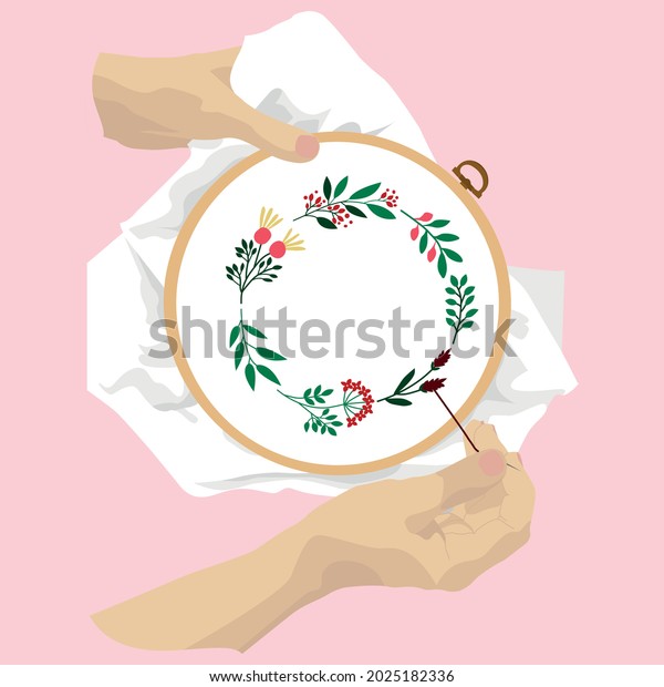The\
embroiderer holds the embroidery frame with one hand, while the\
other hand embroider the pattern onto the fabric. Hands and drums\
on a pink background. Floral embroidery pattern.\
