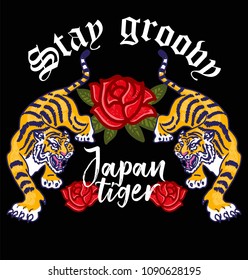 Embroidery angry wild tigers with decorative flowers Japan Tokyo concept Japanese hieroglyphs and lettering "Stay groovy". Modern mascot illustration for print design of clothes t shirt patch sticker.