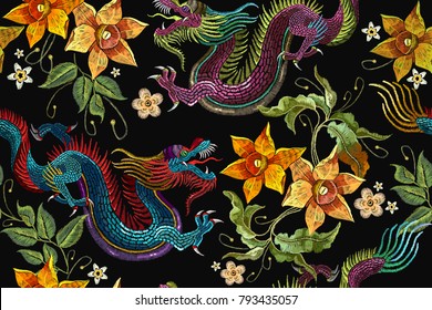 Embroidery Asian dragon and beautiful flowers seamless pattern. China dragons vector 