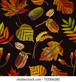Embroidery autumn seamless pattern. Fashionable template for design of clothes, t-shirt design. Classical september embroidery autumn leaves, acorns wild forest, oak and maple leaves 