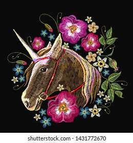 Embroidery beautiful unicorn head and summer flowers. Fairy tale magic art. Fashion template for kids clothes, t-shirt design 