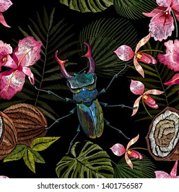 Embroidery beetle deer, palm leaves and orchid flowers seamless pattern. Jungle art.  Summer tropical template for clothes, textiles, t-shirt design 