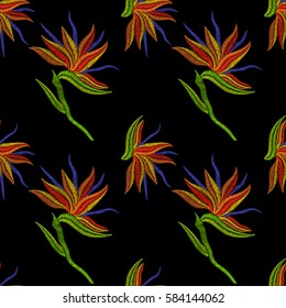 Embroidery Bird of Paradise flowers, tropical Strelitzia seamless pattern. Vector fashion ornamental floral print on black background for fabric traditional folk decoration.