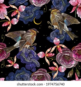 Embroidery birds, night sky, red roses and pink orchid flowers seamless pattern. Tropical night. Fashion template for clothes, textiles, t-shirt design. Summer jungle art 