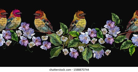 Embroidery birds on branch, spring violet flowers. Horizontal seamless pattern. Fashion clothes template, t-shirt design