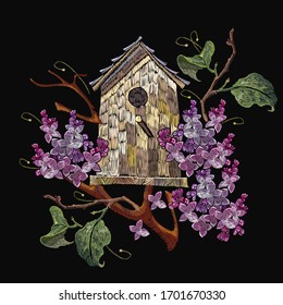 Embroidery blossoming lilac flowers bouquet and wooden bird house. Spring fashion template for clothes, textiles, t-shirt design 