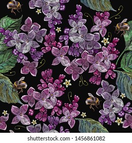 Embroidery blossoming lilac flowers  and bumble bee seamless pattern. Spring floral art. Fashion template for clothes, textiles, t-shirt design 