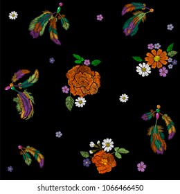 Embroidery boho native american indian feathers flowers arrangement. Clothes ethnic tribal fashion design decoration fabric. Fashionable template vector seamless pattern illustration