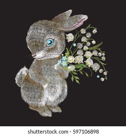 Embroidery bunny with a bouquet of lilies of the valley. Vector traditional folk cute rabbit character with flowers on black background.