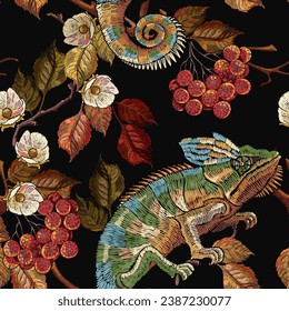 Embroidery chameleon lizard, red branches of a mountain ash berry and white flowers. Seamless pattern. Gothic template for design of clothes