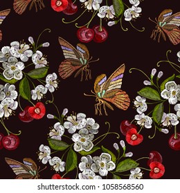 Embroidery cherry blossom tree and cherry fruit berry and butterfly seamless pattern. Template for clothes, textiles, t-shirt design