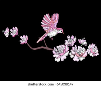 Embroidery cherry or sakura branch blossom and bird.