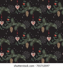 Embroidery christmas seamless pattern with hearts, pine and snow balls. Vector embroidered new year floral design for fashion, fabric, wrapping.