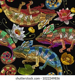 Embroidery colorful chameleons and water lilies seamless pattern. Tropical art template for clothes, textiles, t-shirt design. Classical embroidery chameleons, white and pink lilies pattern 