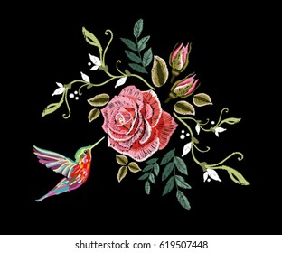 Embroidery colorful floral pattern composition with pink roses and hummingbird. Vector traditional folk fashion ornament on black background.