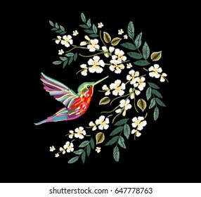 Embroidery colorful floral pattern with japanese flowers, hummingbird. Vector traditional folk fashion ornament on black background.
