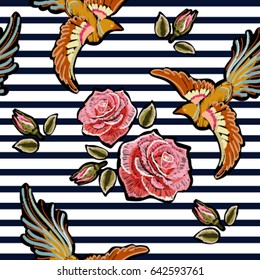 Embroidery colorful floral pattern with pink roses, japanese bird. Vector traditional folk fashion ornament on black background.