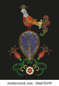 Embroidery colorful floral pattern with red exotic bird. Vector trend folk peacock with flowers ornament on black background for fashion design.