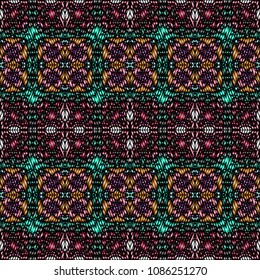 Embroidery colorful pattern with geometric ornament.