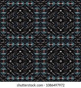 Embroidery colorful pattern with geometric ornament.