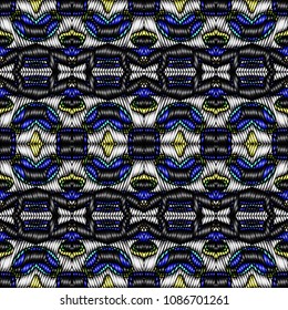 Embroidery colorful pattern with geometric ornament.
