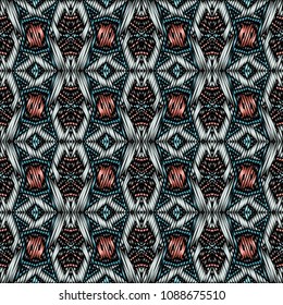Embroidery colorful pattern with geometric ornament.