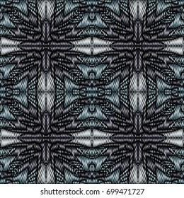 Embroidery colorful pattern with geometric ornament.
