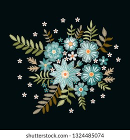 Embroidery composition with beautiful light blue wild flowers and green leaves. 